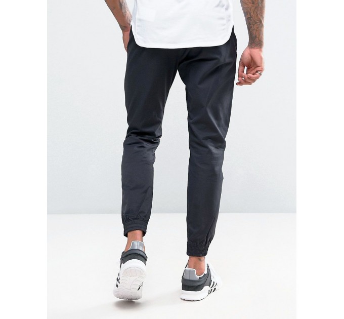 Спортивные брюки Nike NSW Players Jogger Woven 010